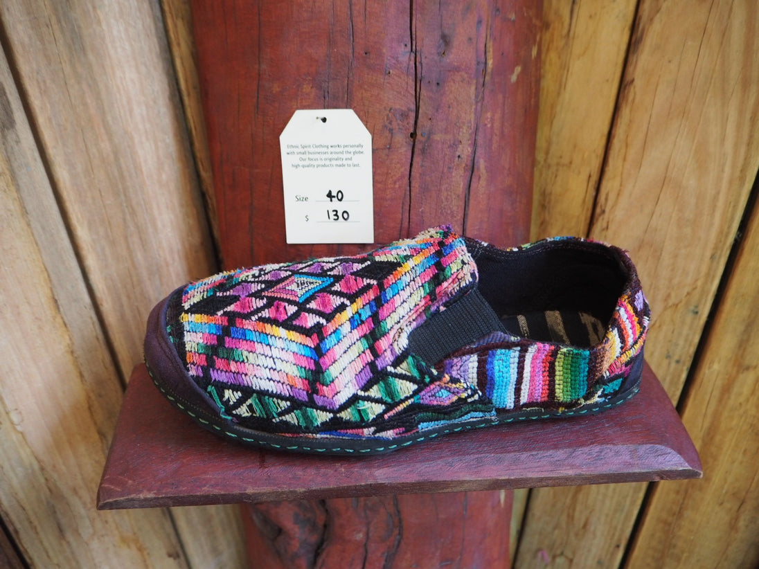 rainbows on black elasticated slip ons